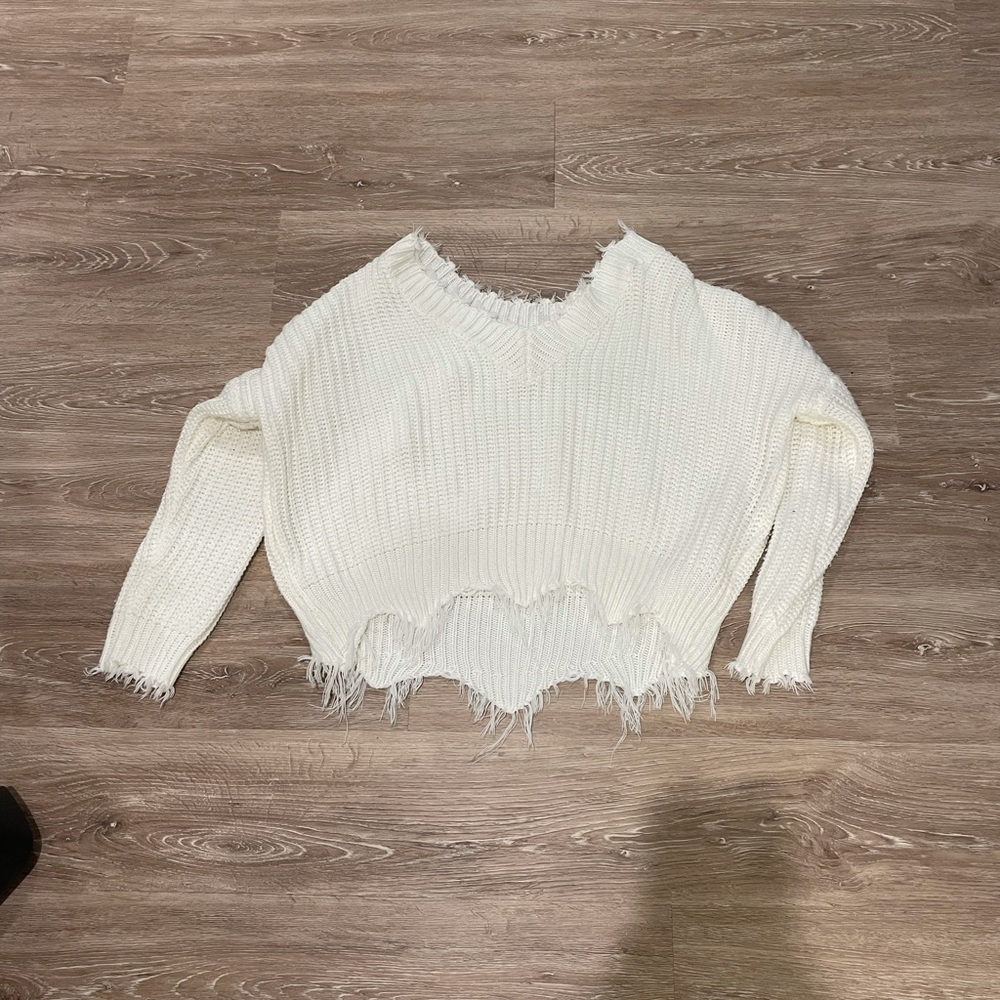 Oversized White fringe sweater.